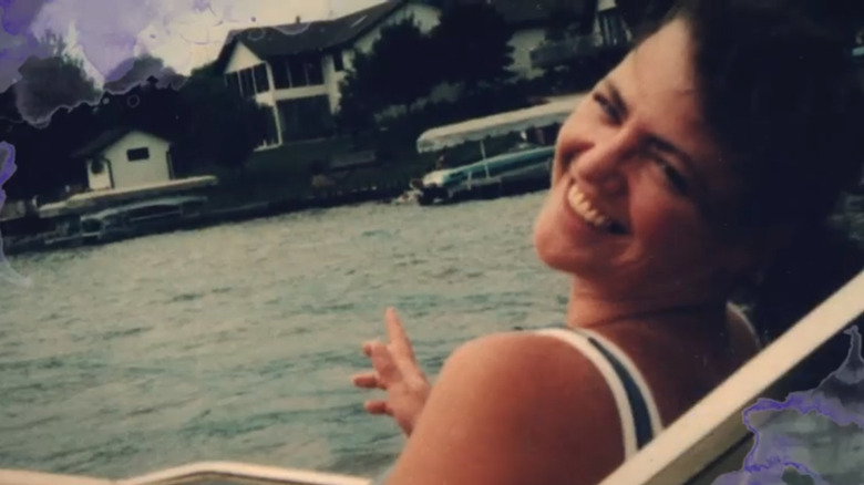 Lori Arnold smiling by the water