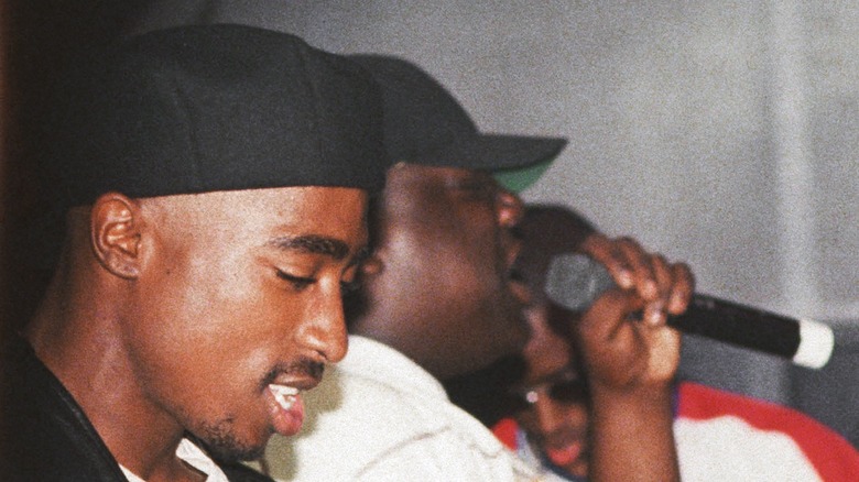 Tupac and Biggie (mic) performing 