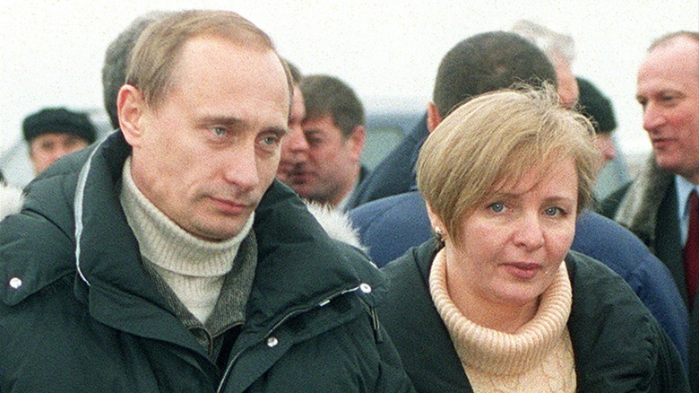 Vladimir Putin and Lyudmila walking