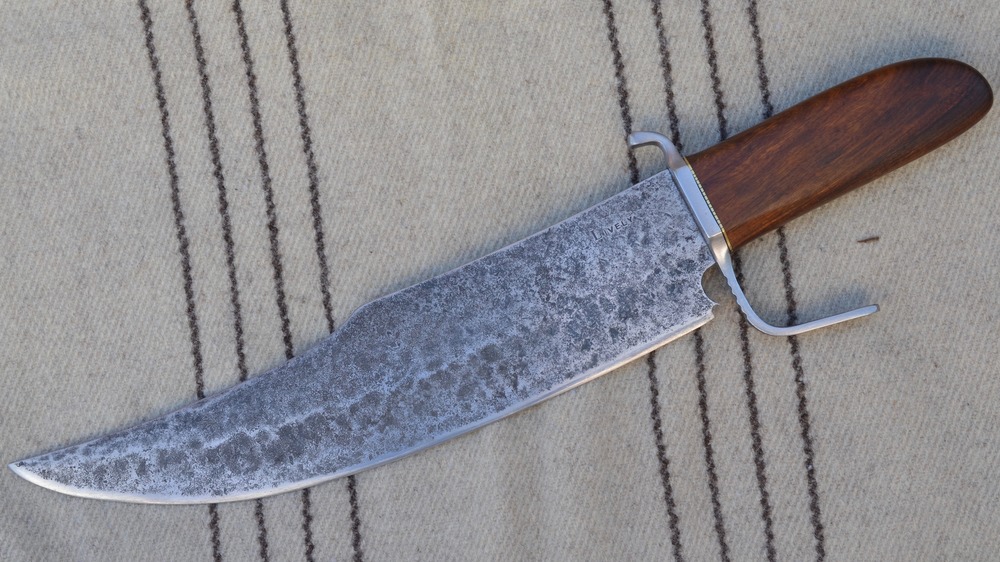 bowie knife laying on cloth