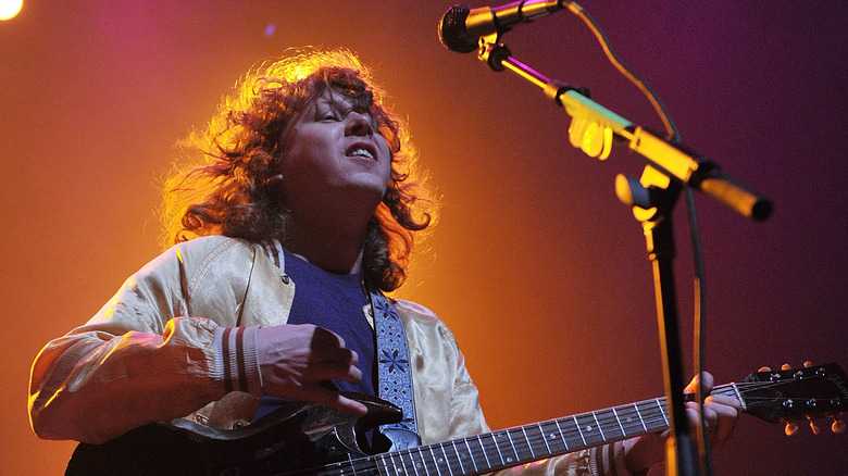 Ben Kweller strums guitar