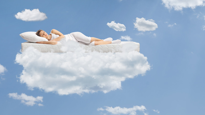 woman sleeping on a cloud