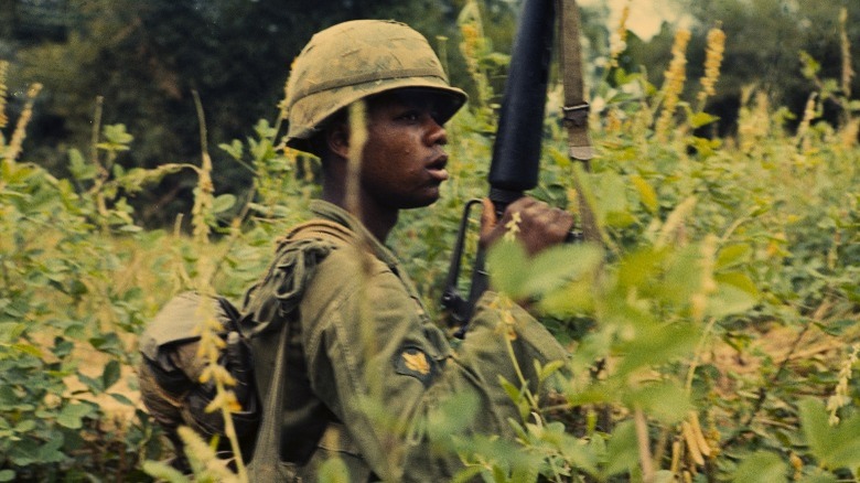 Soldier standing with gun