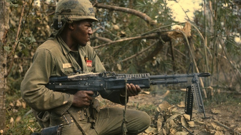 Soldier firing machine gun