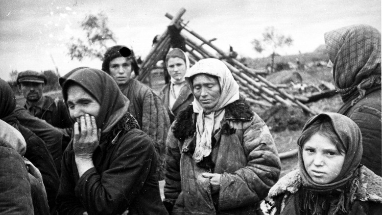 Belarussian villagers mourning their destroyed village