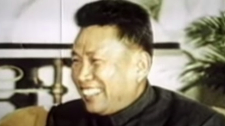 Pol Pot in formal dress smiling