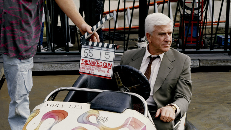 Leslie Nielsen in bumper car in "The Naked Gun"