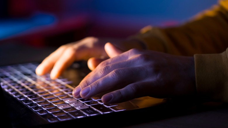 male hands on laptop