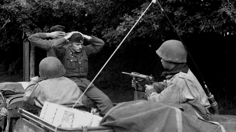 German soldier being taken as POW