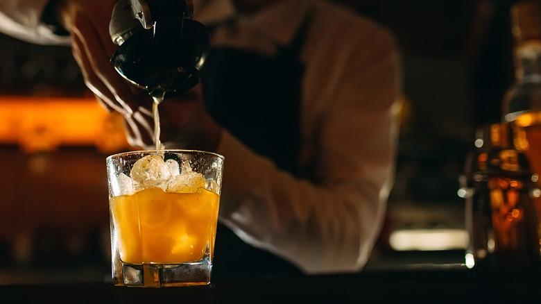 Bartender pouring drink