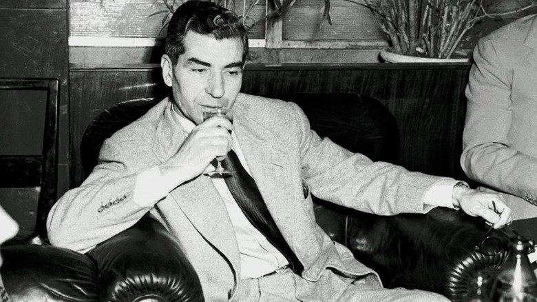 lucky luciano on a couch