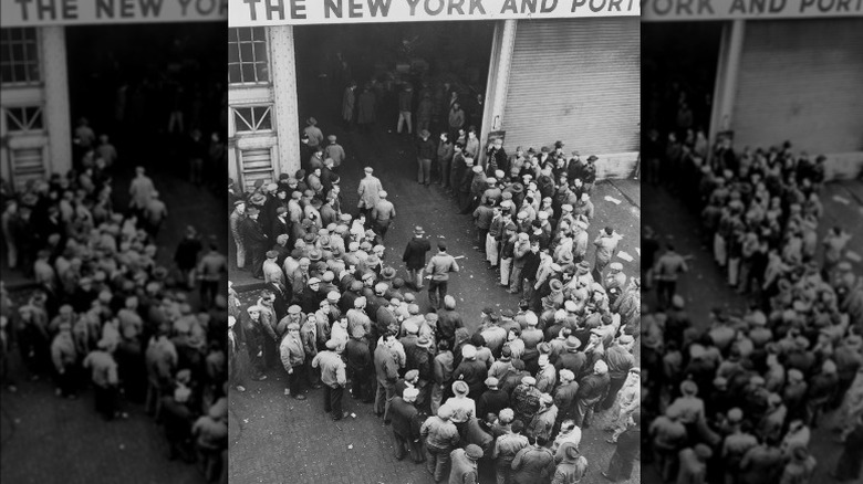 men gathered New York City Docks