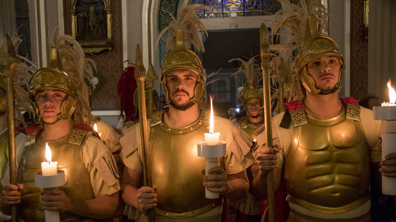 Roman soldiers holding candles