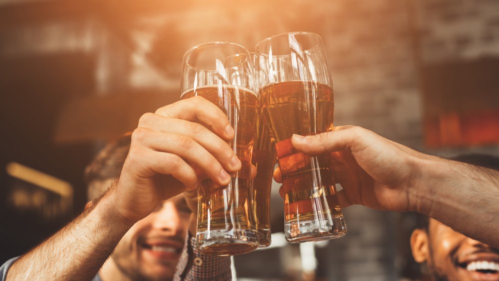 Friends drinking in bar.