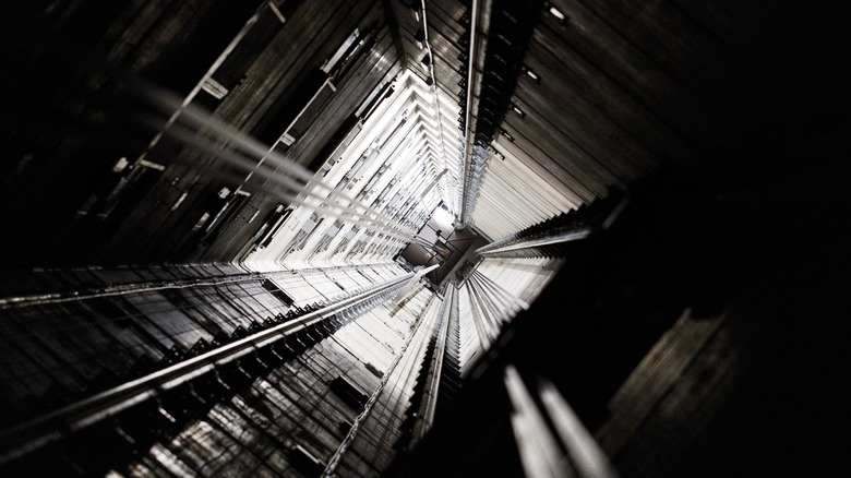 elevator shaft looking up at light