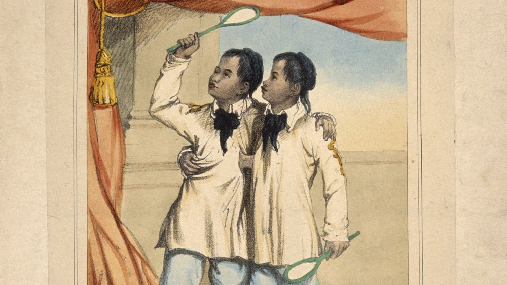 Chang and Eng the Siamese twins, aged eighteen, playing badminton. Lithograph.