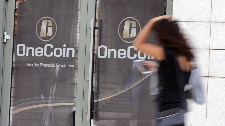 woman passing onecoin office