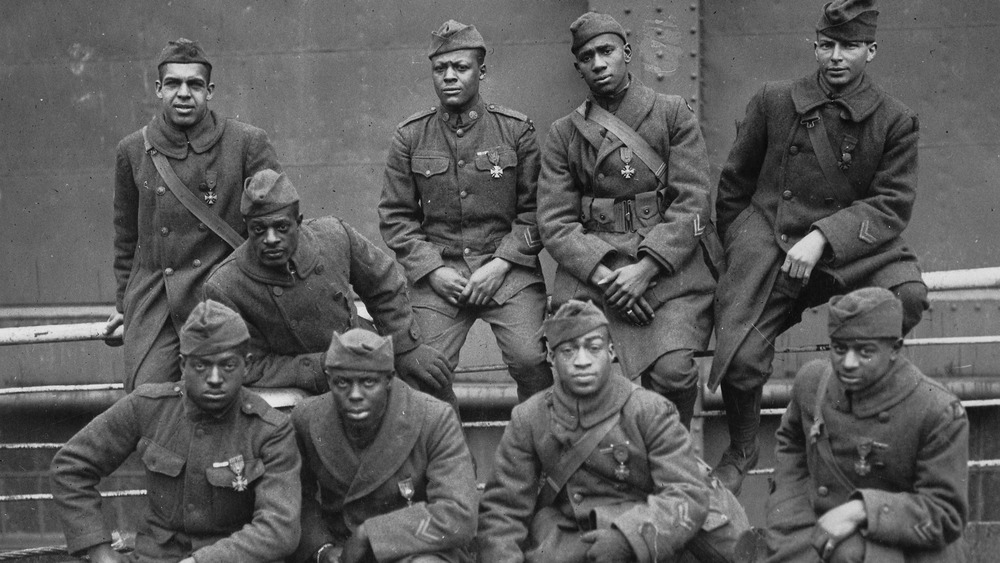 Harlem Hellfighters posing for a photo in uniform, 1919