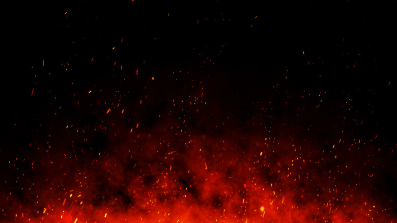 Fire embers over black background