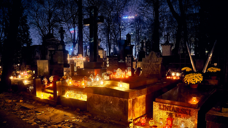 Lights placed on graves in cemetery