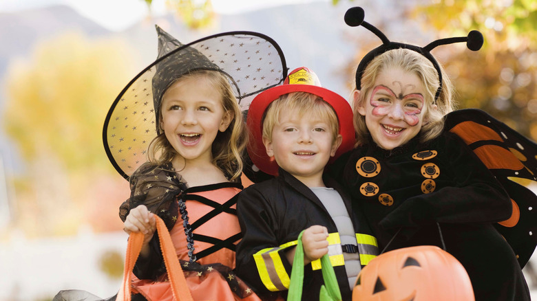 Kids dressed up in costumes for Halloween