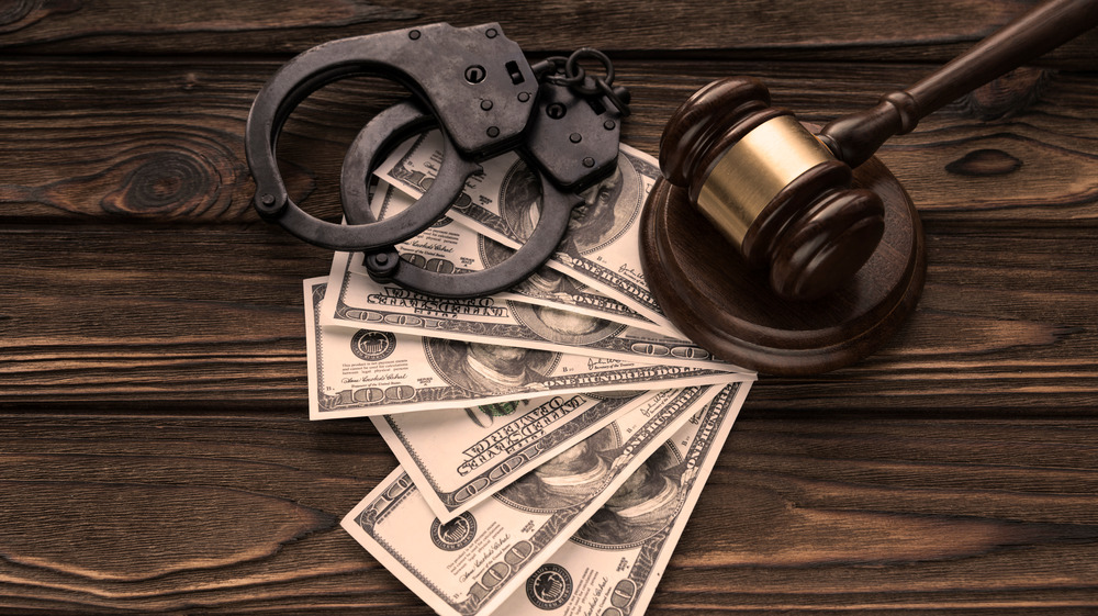 Handcuffs, money, and a gavel