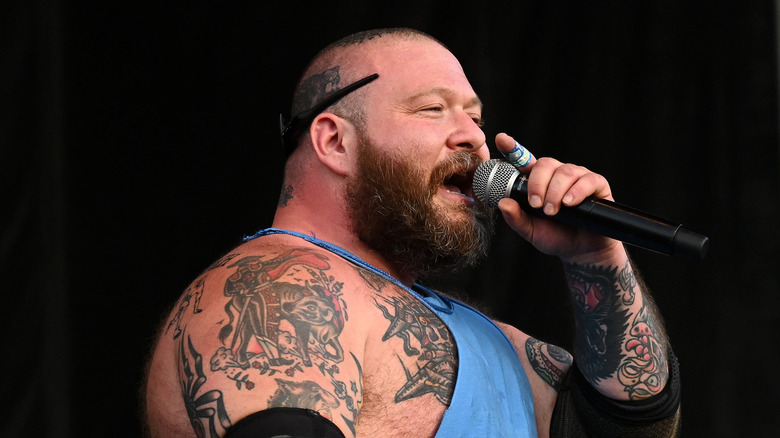 Action Bronson performing stage mic tattoos