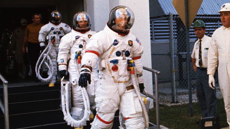 Jim Lovell wearing commander-marked spacesuit