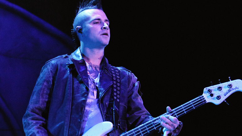 Johnny Christ playing bass on stage