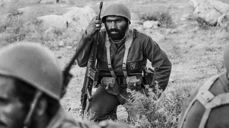 Iranian soldier kneeling