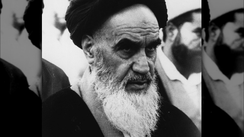 Khomeini frowning looking forward