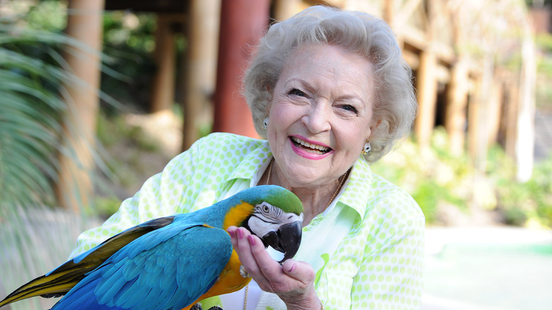 Betty White with a parrot