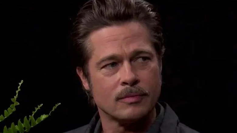 Brad Pitt mustache looking annoyed