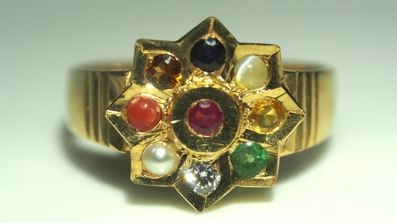 A golden ring studded with nine gems, known as Navaratna