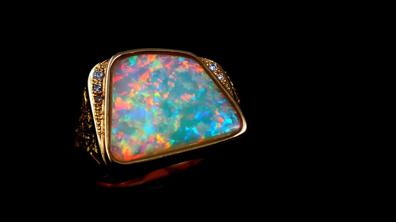 opal ring on black background