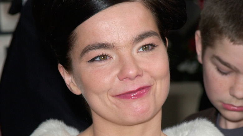 Bjork smiling in white dress