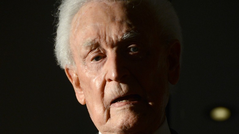 Bob Barker looking sad in shadows