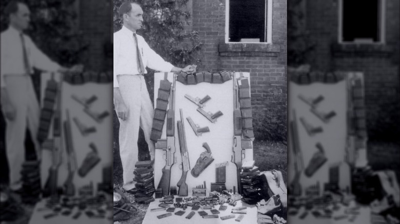 Snapshot from unknown bystander of Barrow Gang guns after ambush, 5/23/34