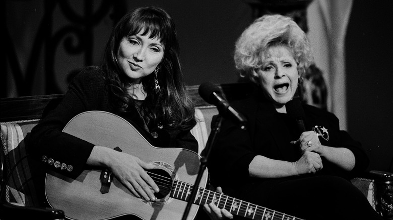 brenda lee and pam tillis performing on stage