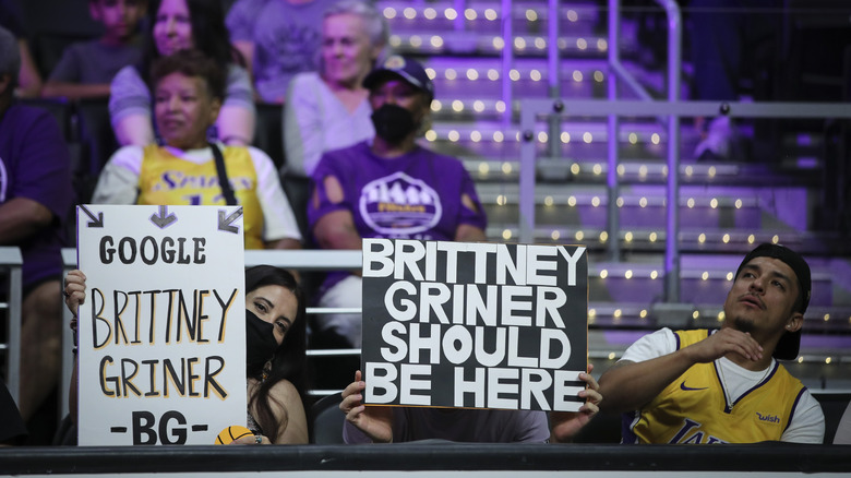 Fans hold up signs in support of Brittney Griner