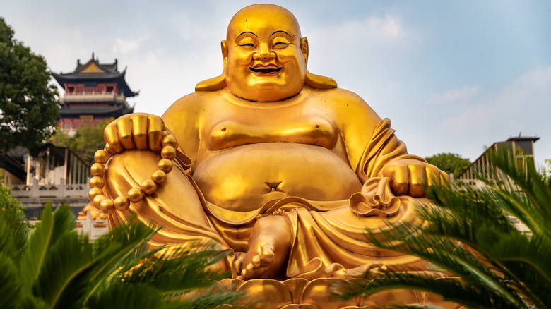 laughing buddha gold statue