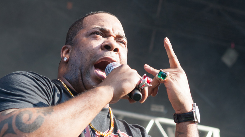 Busta Rhymes holding a microphone