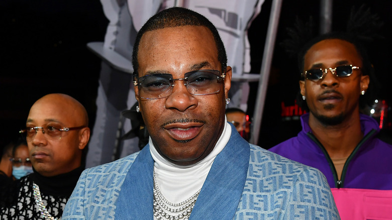 Busta Rhymes sunglasses blue jacket