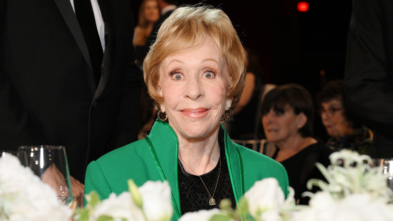 Carol Burnett green jacket event smiling