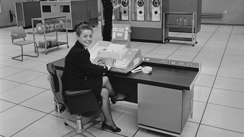 1970 woman working at a computer