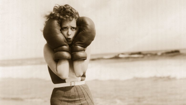 Clara Bow wearing boxing gloves