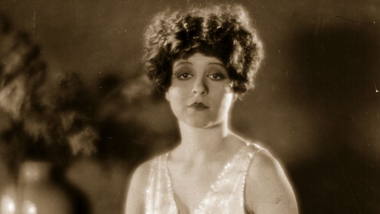 Clara Bow wearing a white dress