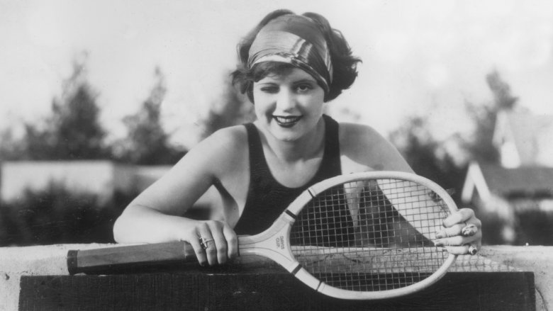 Clara Bow holding a tennis racket