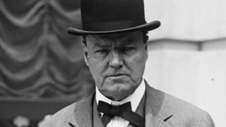 clarence darrow in a suit and hat