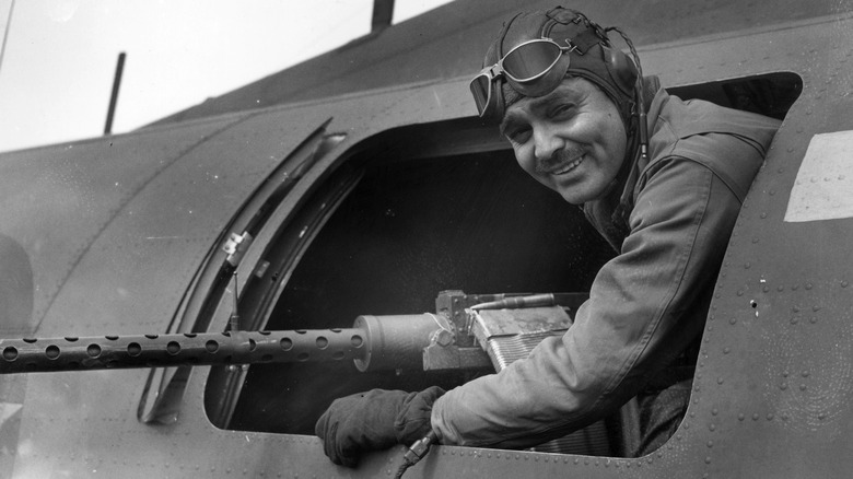 Clark Gable posing in a jet